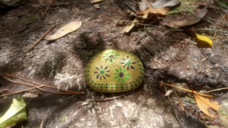 Painted stone on the way around the blue lake