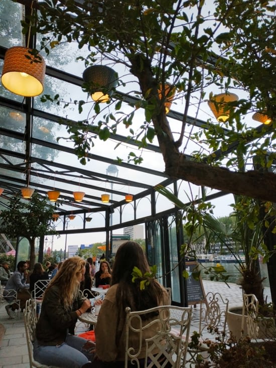 A small cafe in front of the Seine