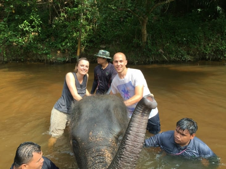 Playing with the baby elephant in the water !